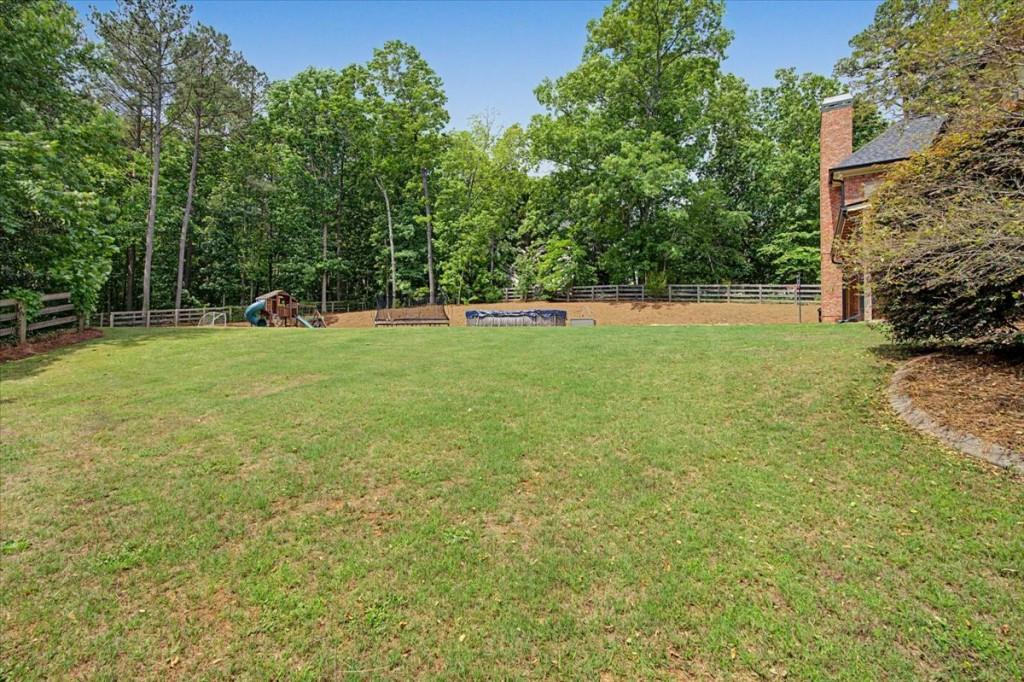 122 Ridge View Drive Ball Ground, GA 30107 - Photo 70 of 84 a view of a field of grass and trees