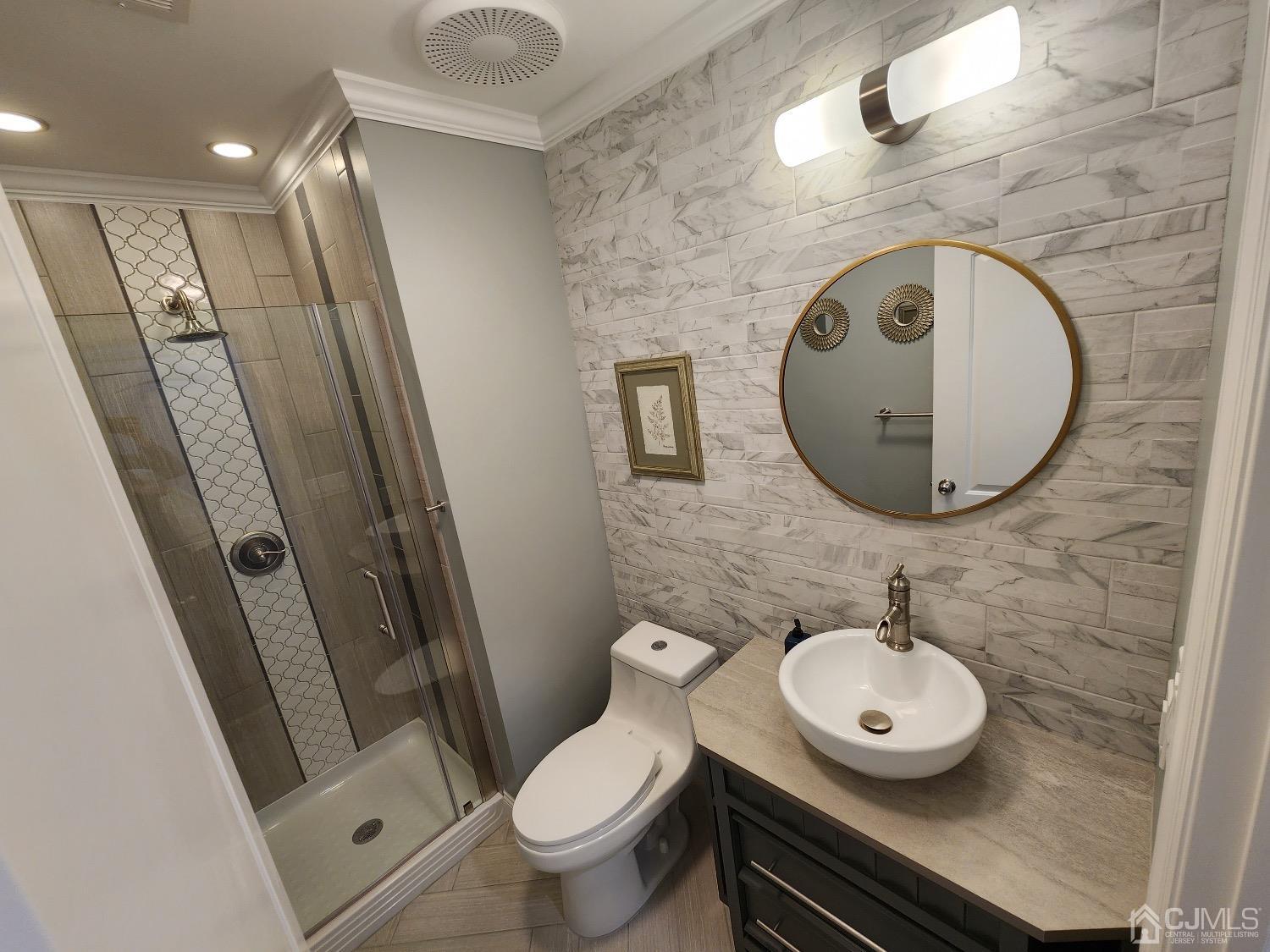 16 Fairfax Road Edison, NJ 08817 - Photo 16 of 40 a bathroom with a sink and a mirror