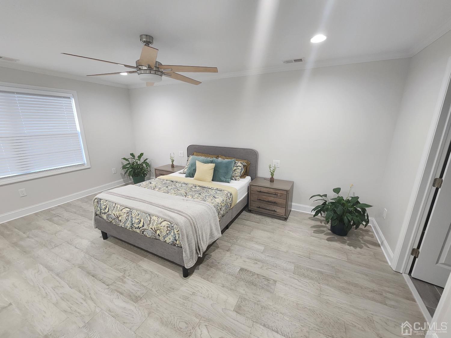 16 Fairfax Road Edison, NJ 08817 - Photo 23 of 40 a bedroom with a bed and a window
