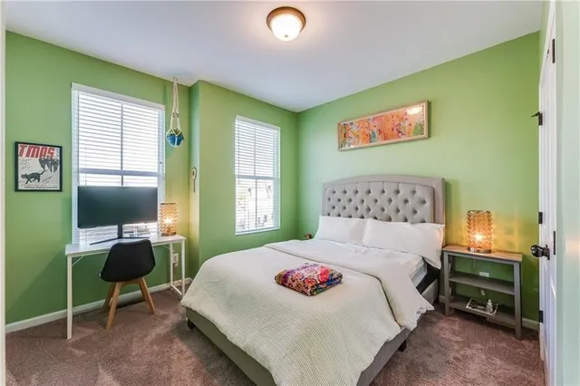 a bedroom with a bed and a table in it