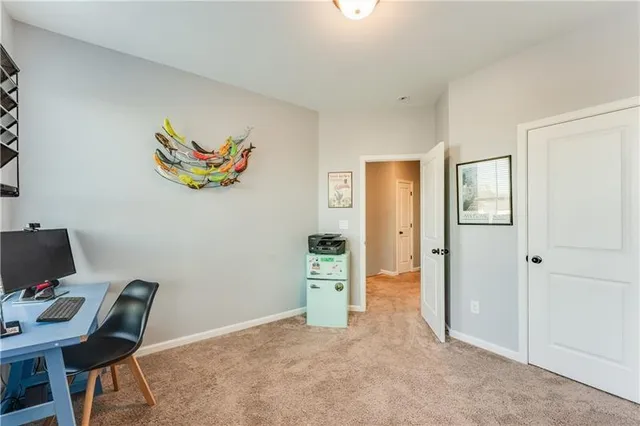 a workspace with furniture and painting on the wall