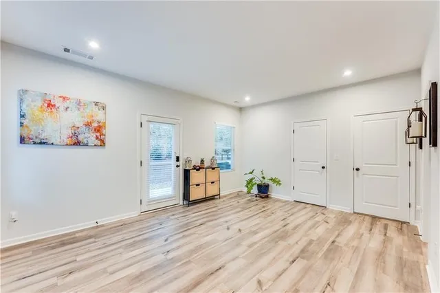 a view of a livingroom with furniture and wooden floor