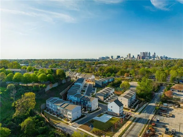 an aerial view of residential houses with outdoor space