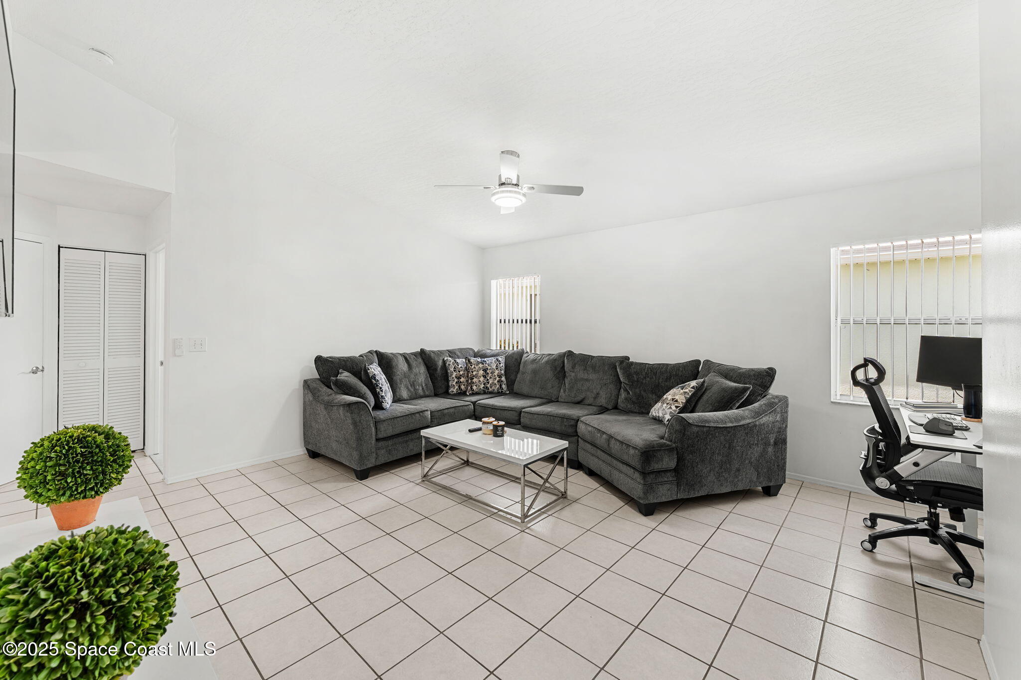 1157 Goldenrod Circle Northeast Palm Bay, FL 32905 - Photo 12 of 31 a living room with furniture and a fireplace