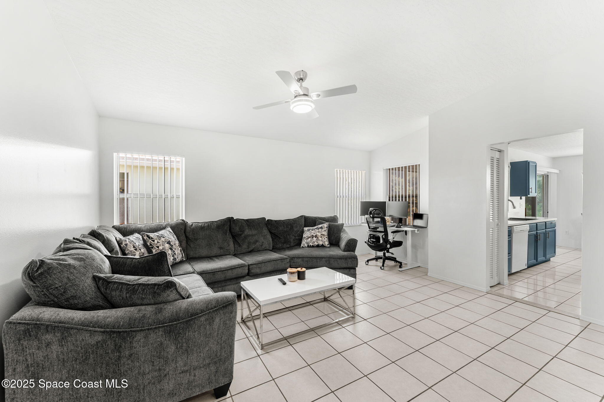 1157 Goldenrod Circle Northeast Palm Bay, FL 32905 - Photo 13 of 31 a living room with furniture and a couch