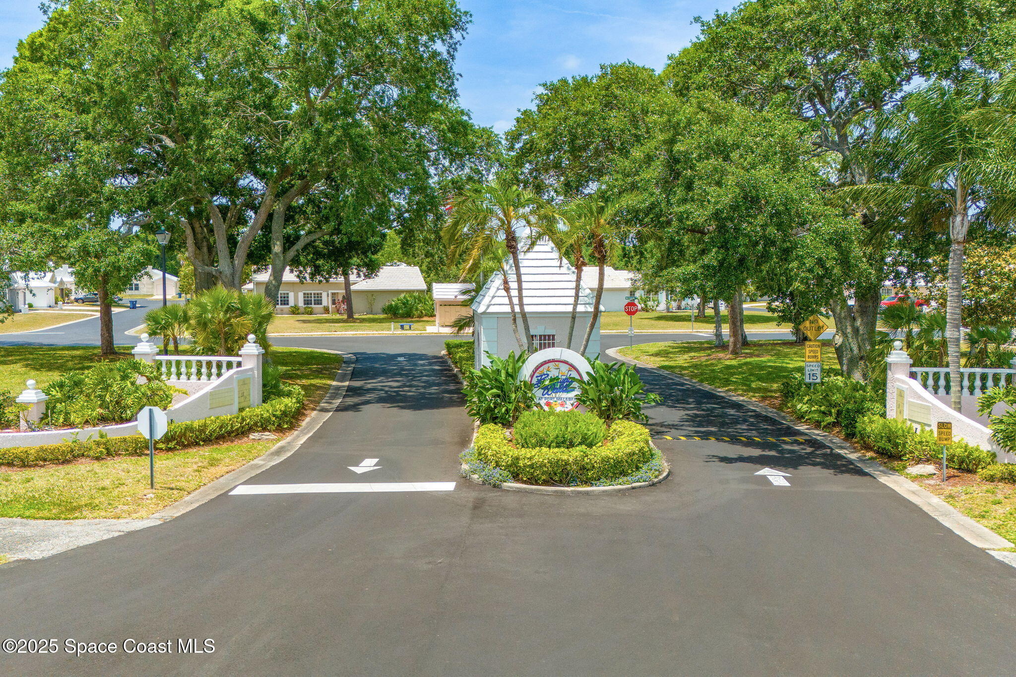 1157 Goldenrod Circle Northeast Palm Bay, FL 32905 - Photo 26 of 31 a front view of a house with a yard and fountain