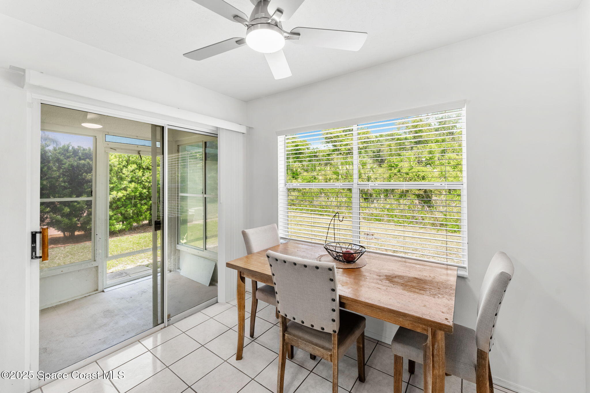 1157 Goldenrod Circle Northeast Palm Bay, FL 32905 - Photo 9 of 31 a view of a dining room with furniture window and outside view