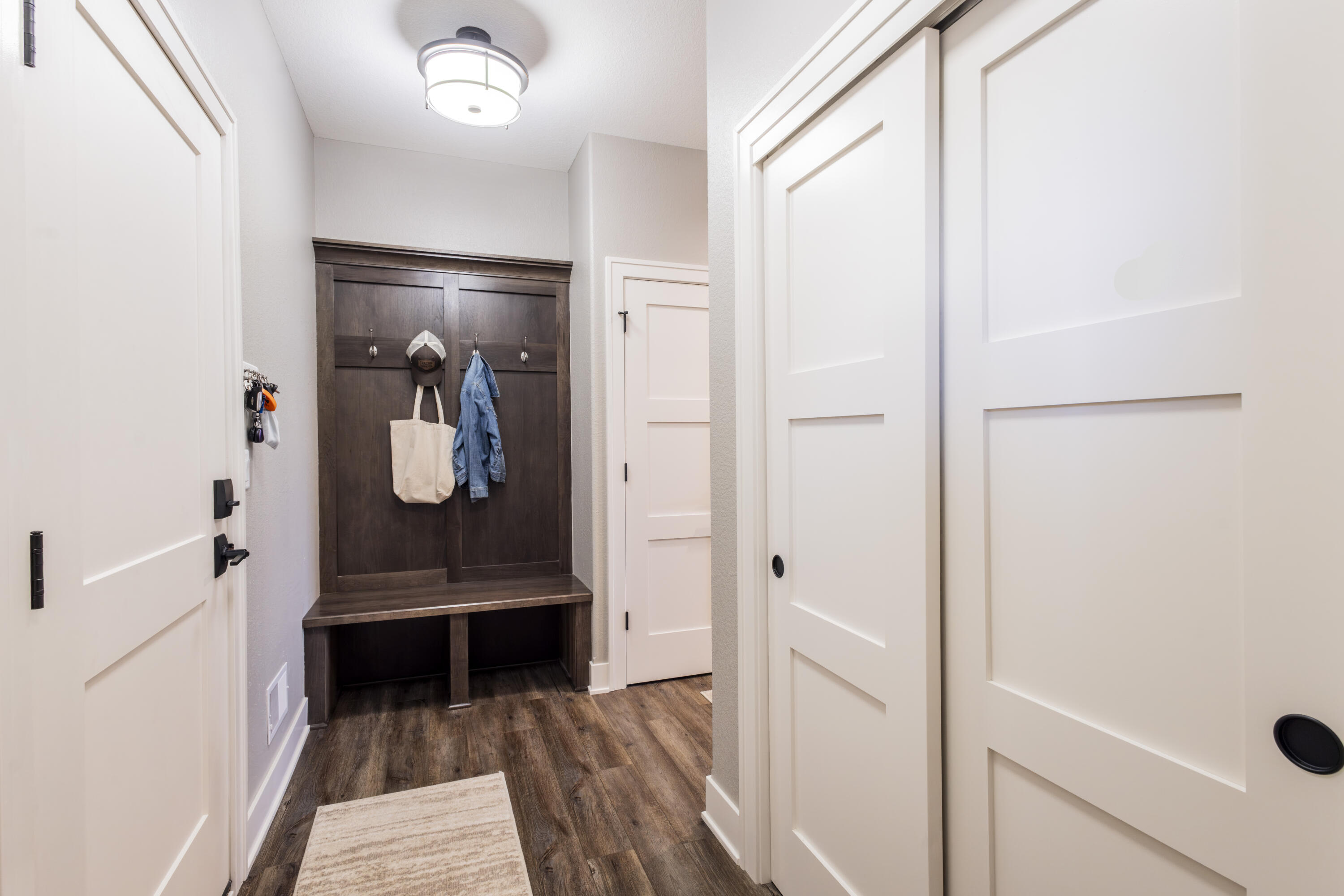 S75W35724 Wilton Road Eagle, WI 53119 - Photo 23 of 42 Foyer area with built in coat hooks, bench and shoe storage.