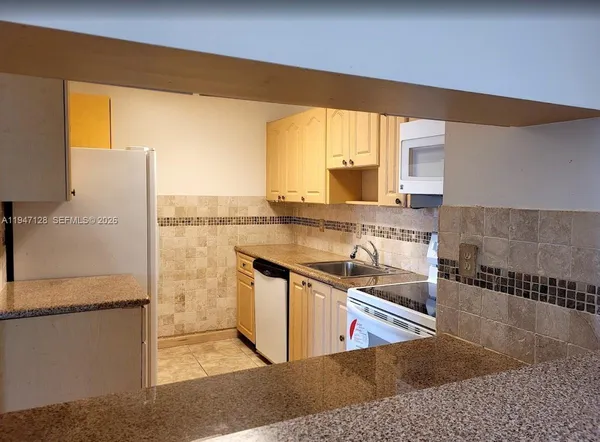 a view of a kitchen with a ocean view