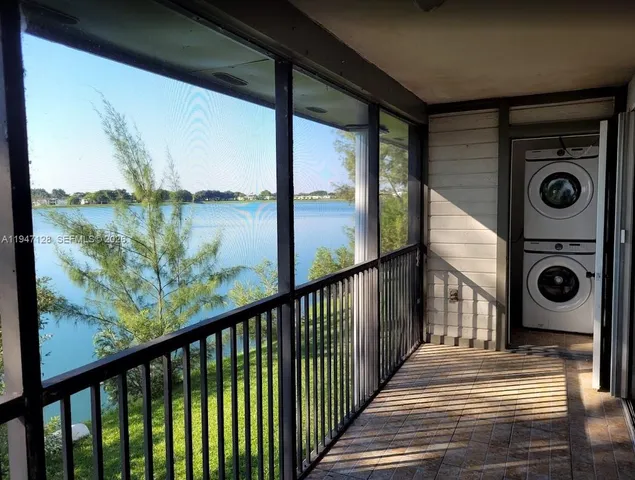 a view of a palm tree with sitting area