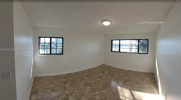 a view of an empty room and window