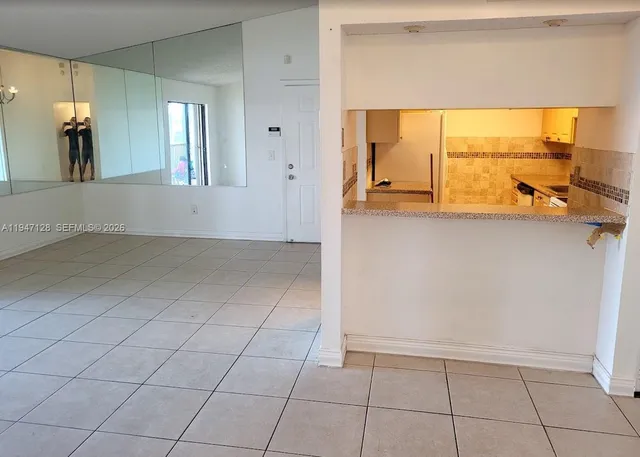 a view of an empty room and window