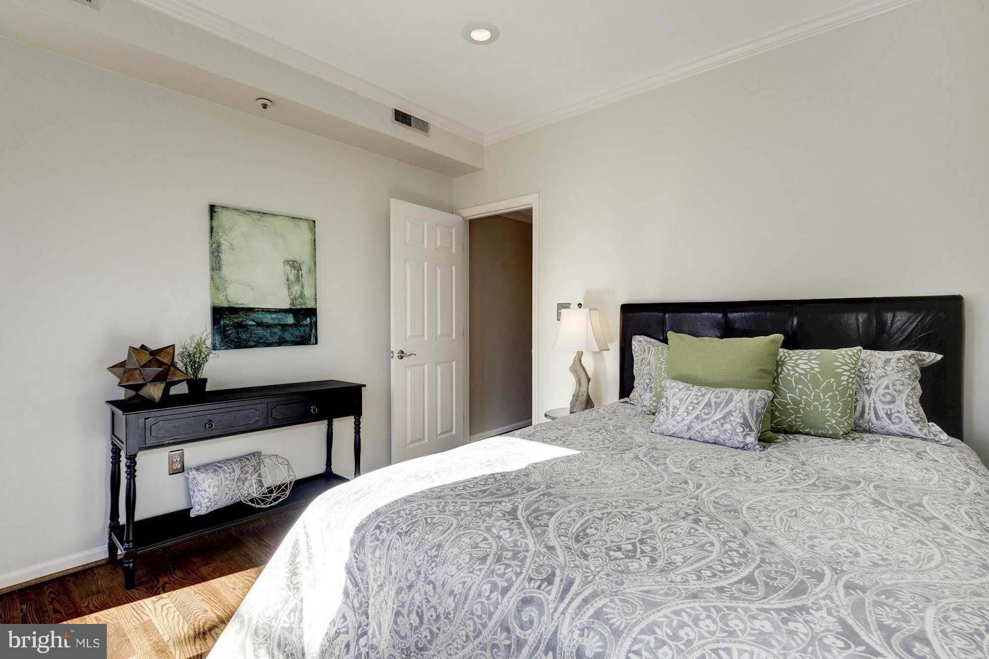 1806 Belmont Road Northwest, Unit 3 Washington, DC 20009 - Photo 15 of 21 a bedroom with a bed and window