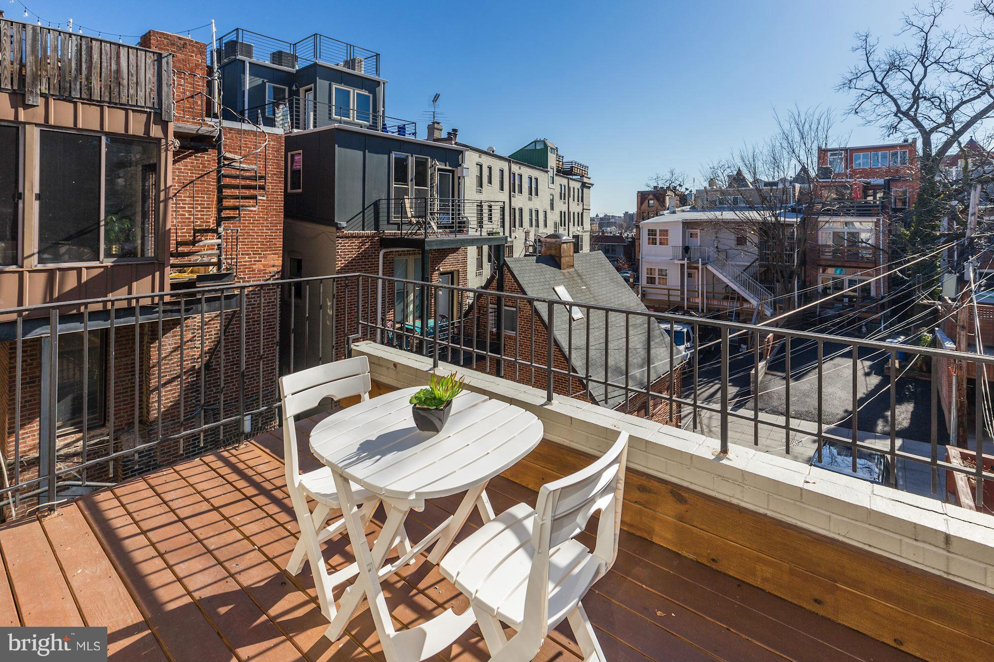 1806 Belmont Road Northwest, Unit 3 Washington, DC 20009 - Photo 17 of 21 a view of a chairs and table on the terrace