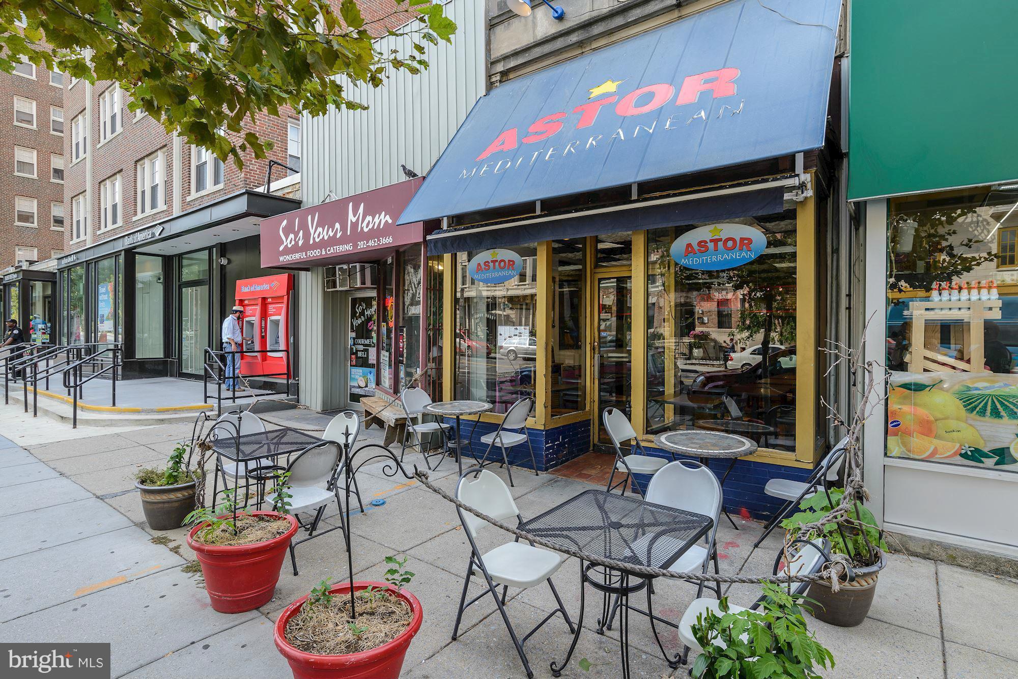 1806 Belmont Road Northwest, Unit 3 Washington, DC 20009 - Photo 19 of 21 a view of a cafe with a couple of people seating on the patio