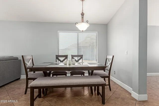a view of a dining room with furniture