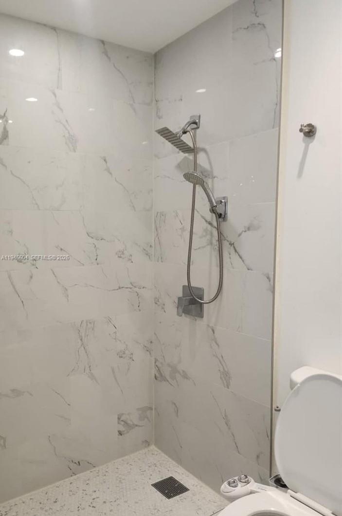 4841 Northwest 7th Street, Unit 2034 Miami, FL 33126 - Photo 6 of 8 a bathroom with a shower