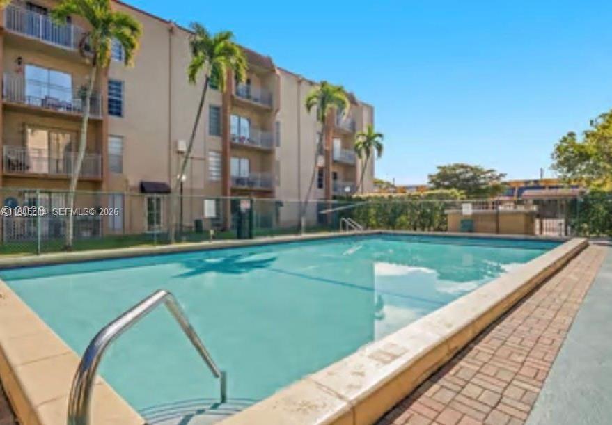 4841 Northwest 7th Street, Unit 2034 Miami, FL 33126 - Photo 8 of 8 a view of a city with tall buildings