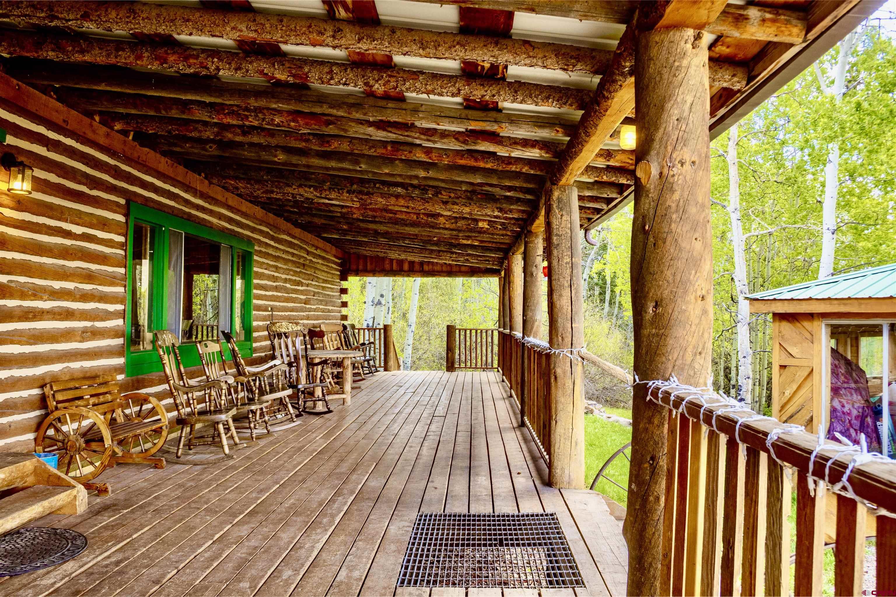 16 Arellano Road, Unit TRES CUERDAS LODGE Amalia, NM 87512 - Photo 16 of 45 a view of porch with seating area
