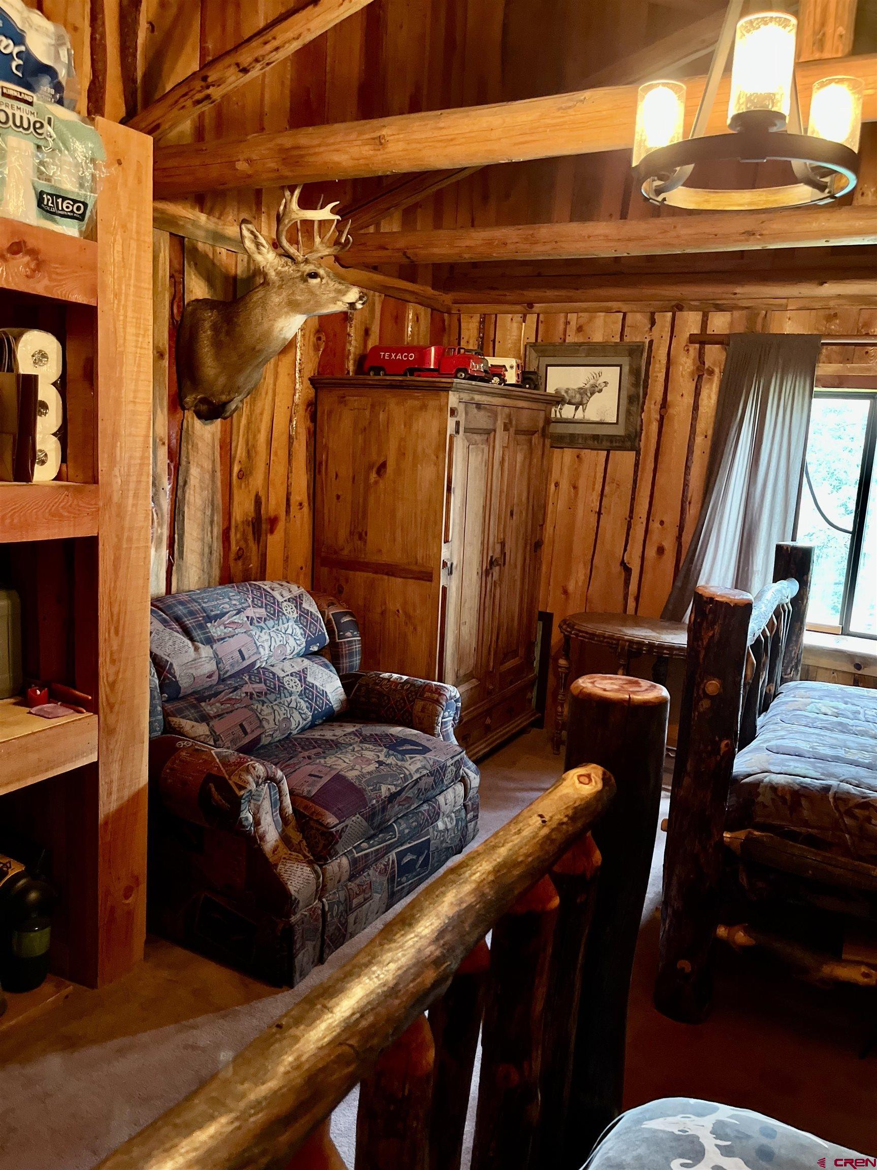 16 Arellano Road, Unit TRES CUERDAS LODGE Amalia, NM 87512 - Photo 39 of 45 a view of room with furniture