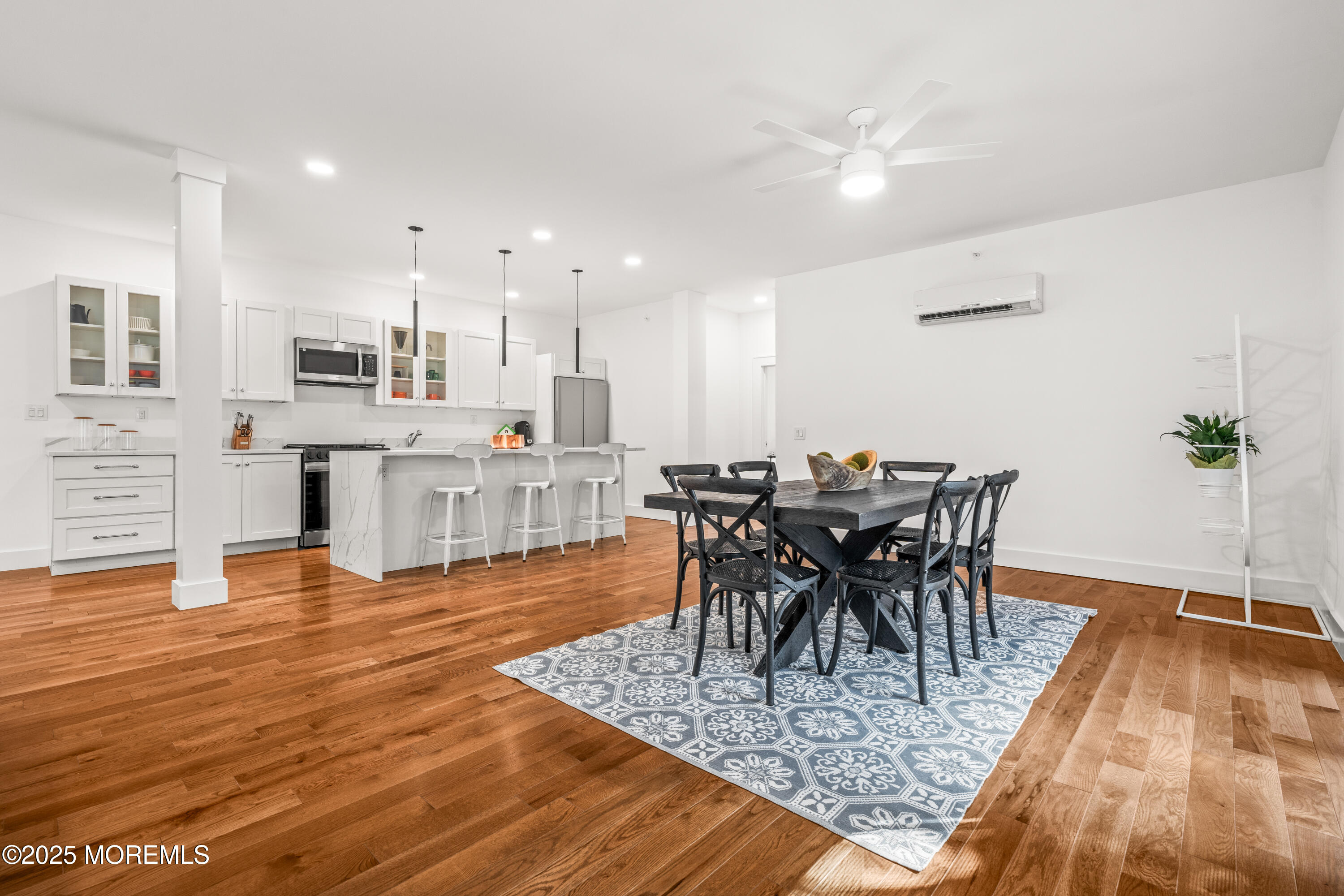 73 3rd Avenue, Unit B Atlantic Highlands, NJ 07716 - Photo 6 of 9 a view of a dining room with furniture and wooden floor