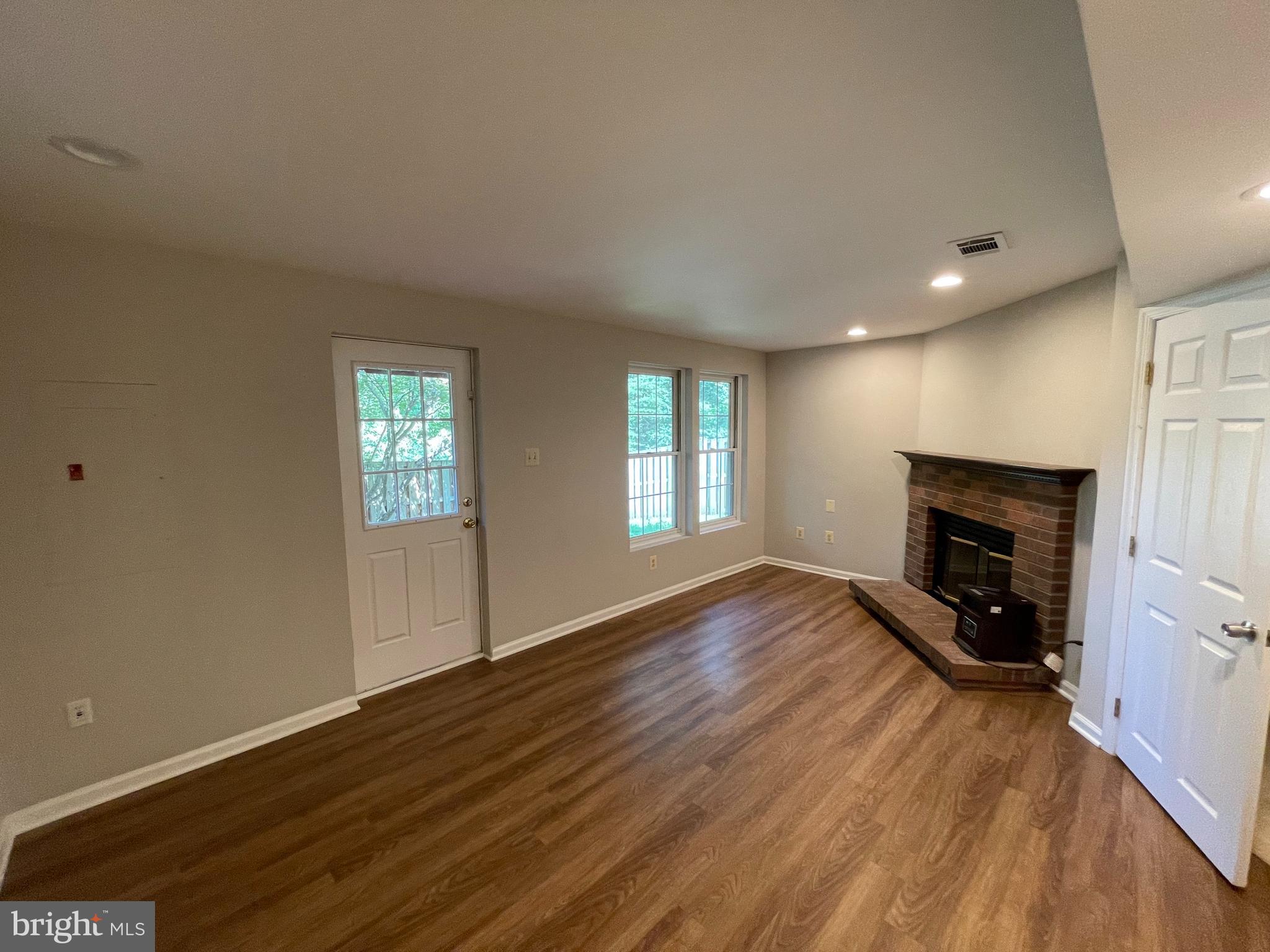 21924 Greentree Terrace Sterling, VA 20164 - Photo 14 of 29 a view of an empty room with window and fire place