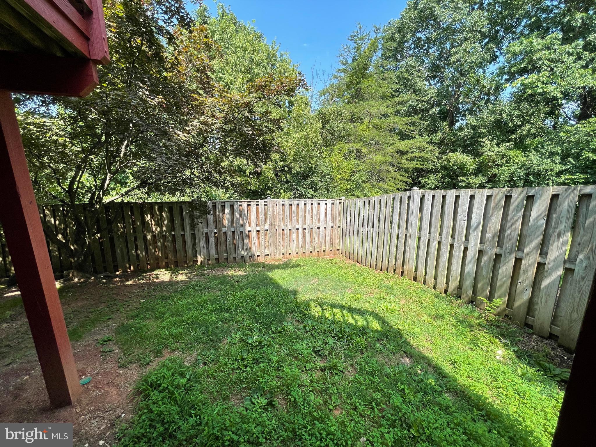 21924 Greentree Terrace Sterling, VA 20164 - Photo 17 of 29 a view of a backyard with a tree