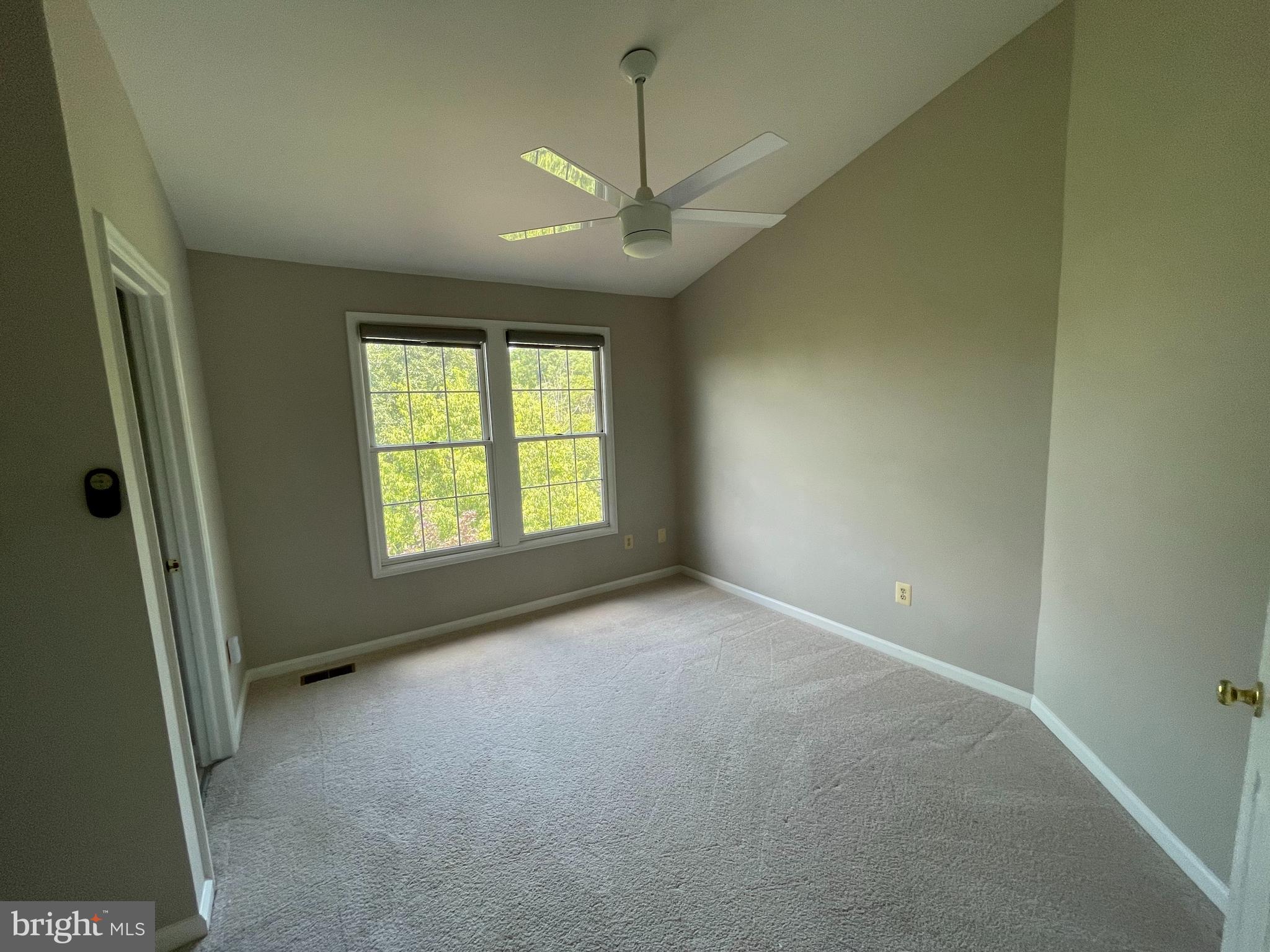 21924 Greentree Terrace Sterling, VA 20164 - Photo 20 of 29 an empty room with windows and fan