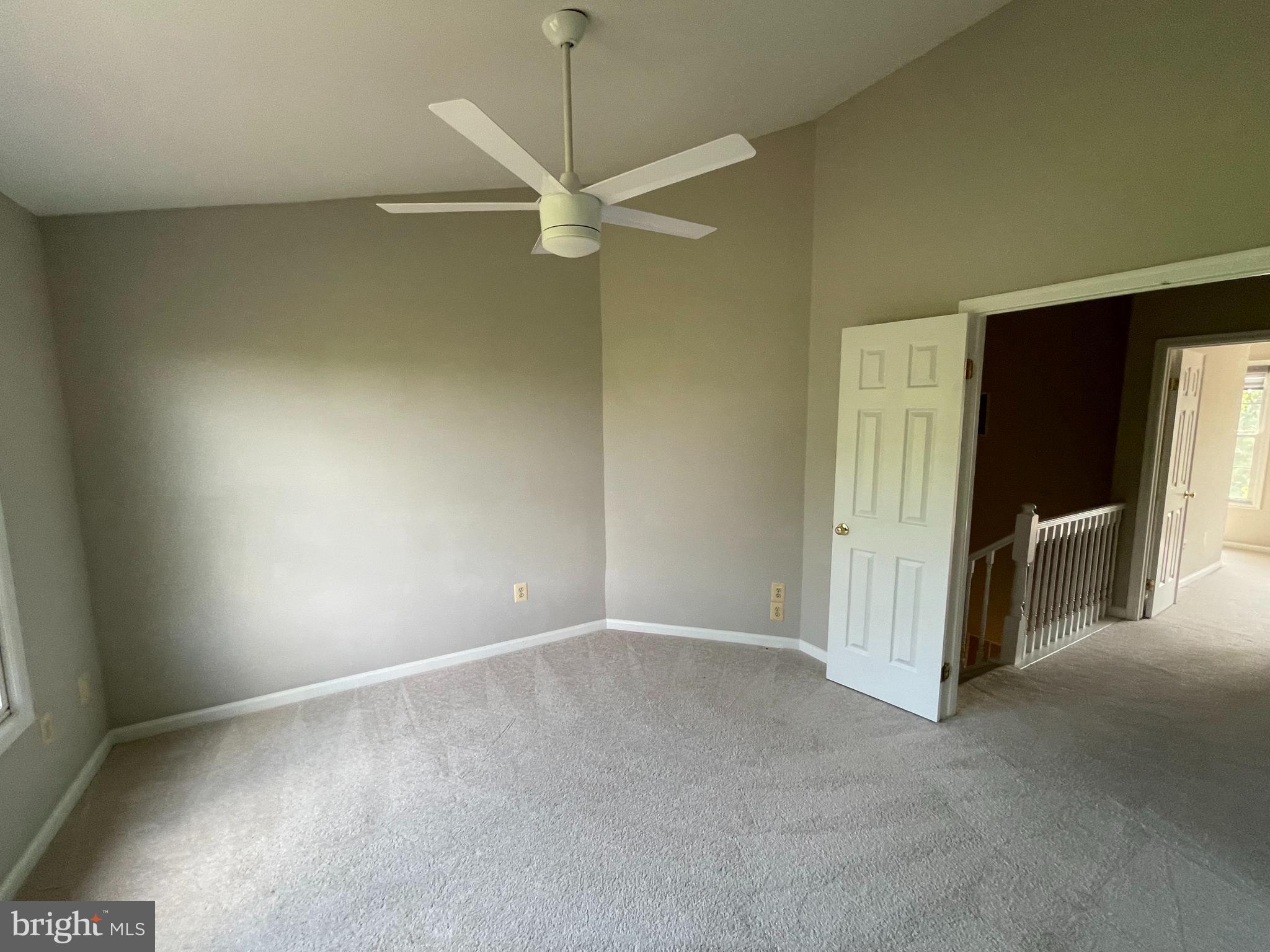 21924 Greentree Terrace Sterling, VA 20164 - Photo 23 of 29 an empty room with a empty space and a ceiling fan
