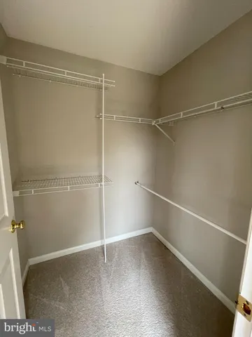 a view of a room with racks on the wall