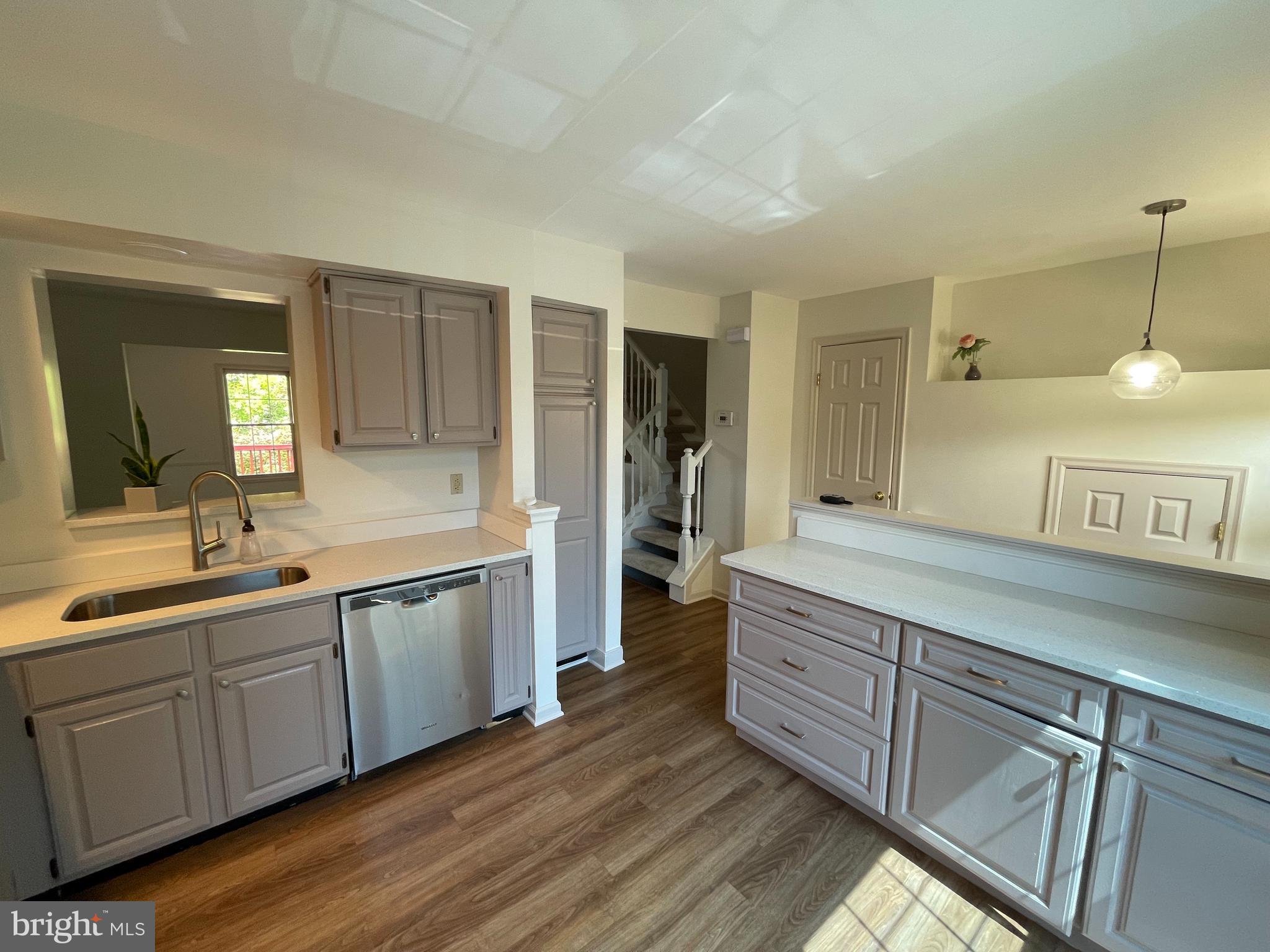21924 Greentree Terrace Sterling, VA 20164 - Photo 3 of 29 a spacious bathroom with double vanity and a mirror