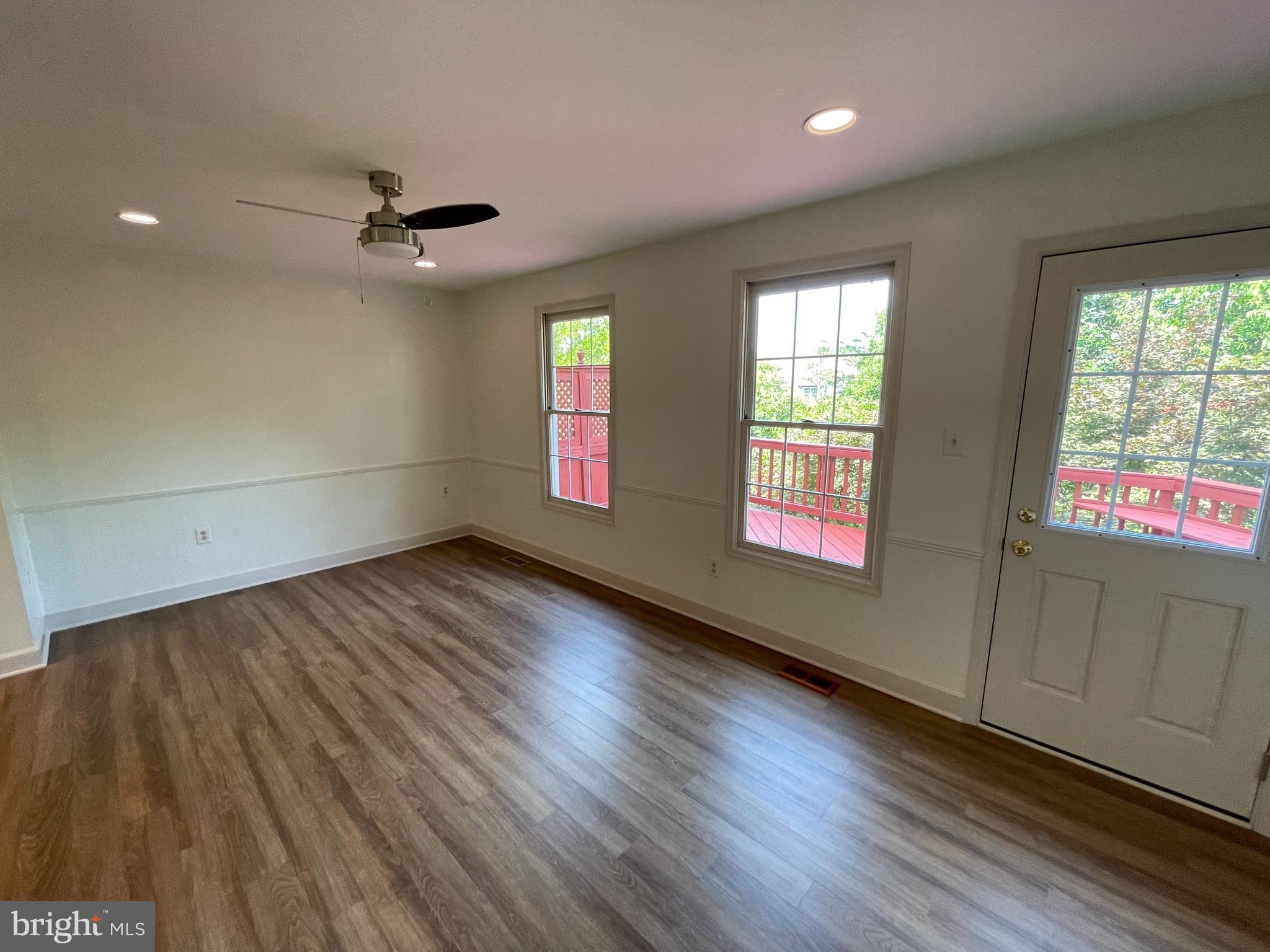 21924 Greentree Terrace Sterling, VA 20164 - Photo 8 of 29 a view of empty room with wooden floor and fan
