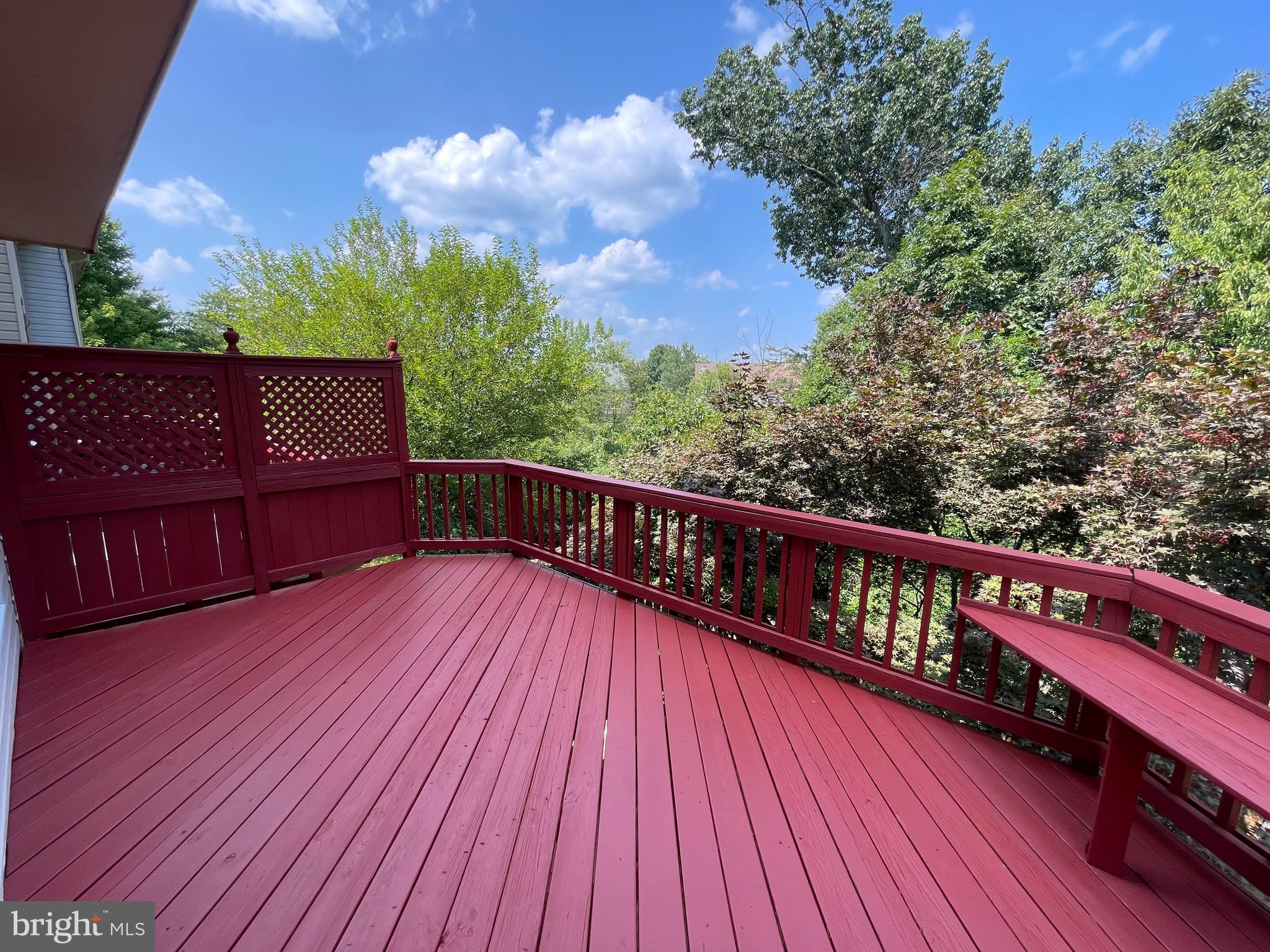 21924 Greentree Terrace Sterling, VA 20164 - Photo 9 of 29 a balcony with wooden floor