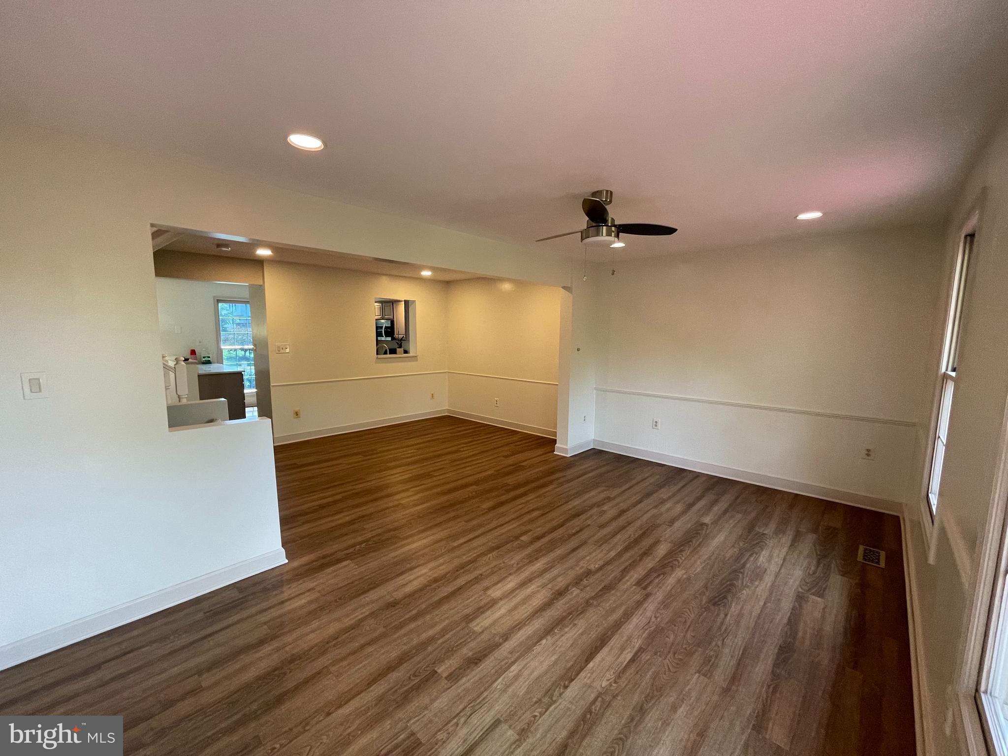 21924 Greentree Terrace Sterling, VA 20164 - Photo 10 of 29 wooden floor in an empty room with a window