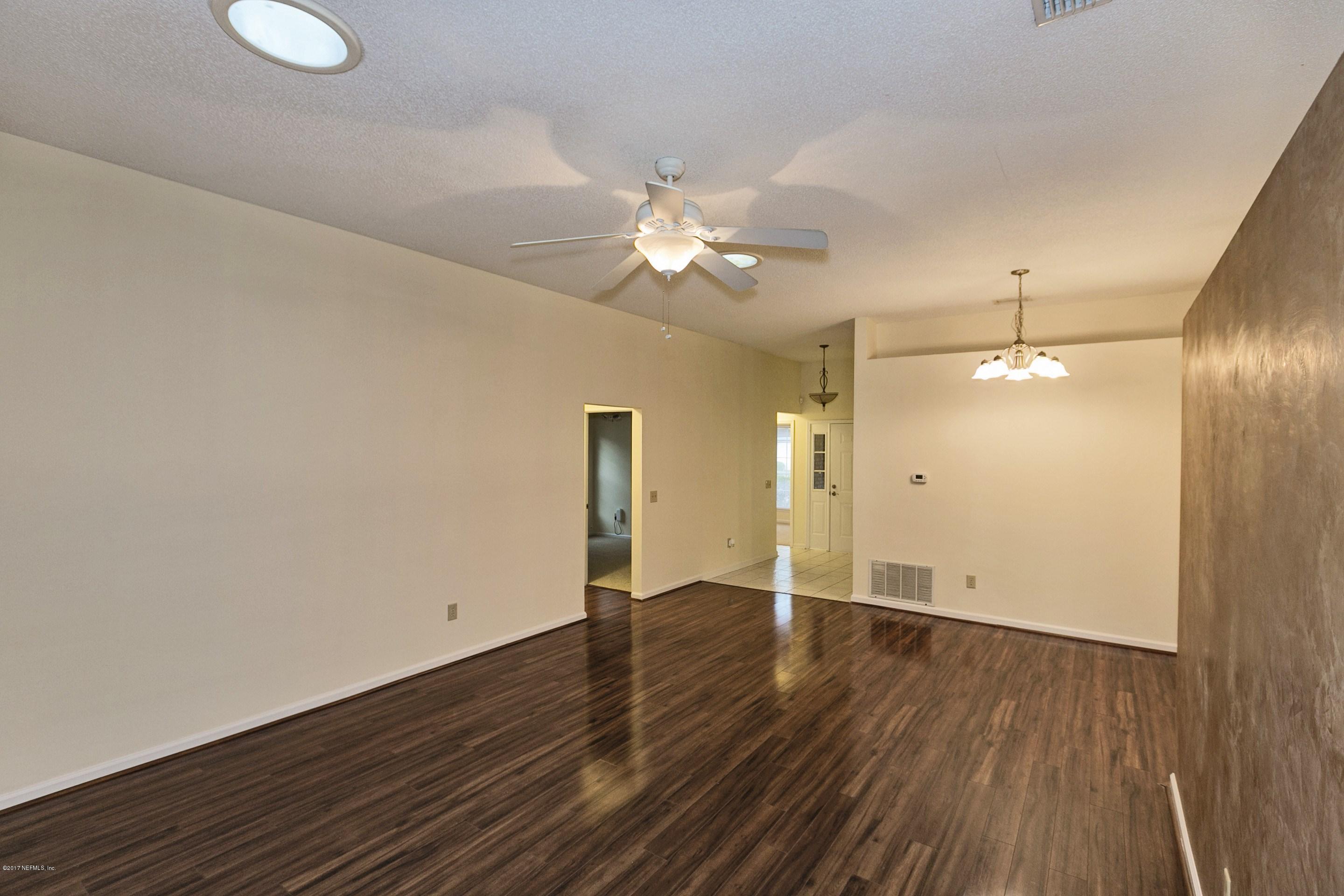 11858 Swooping Willow Road Jacksonville, FL 32223 - Photo 8 of 23 004_Living & Dining Room (2)