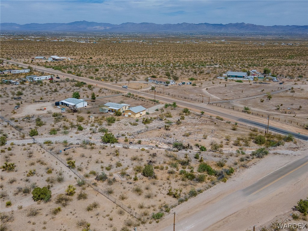 2465 Egar Road Golden Valley, AZ 86413 - Photo 96 of 98 Aerial view of the expansive desert landscape featuring scattered low-lying vegetation and distant mountains