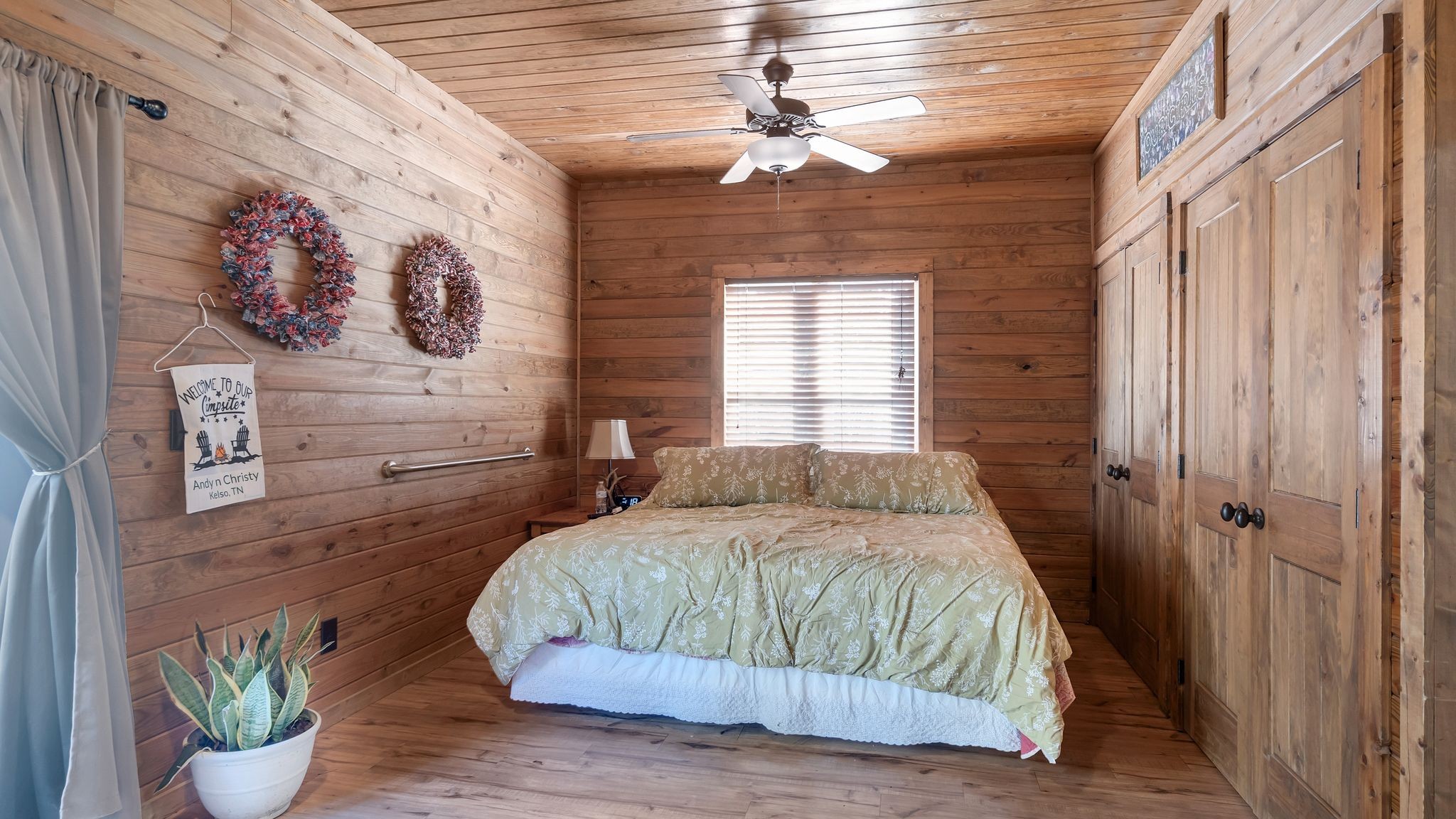 225 Kelso-Smithland Road Kelso, TN 37348 - Photo 17 of 51 a bedroom with a bed and a chandelier