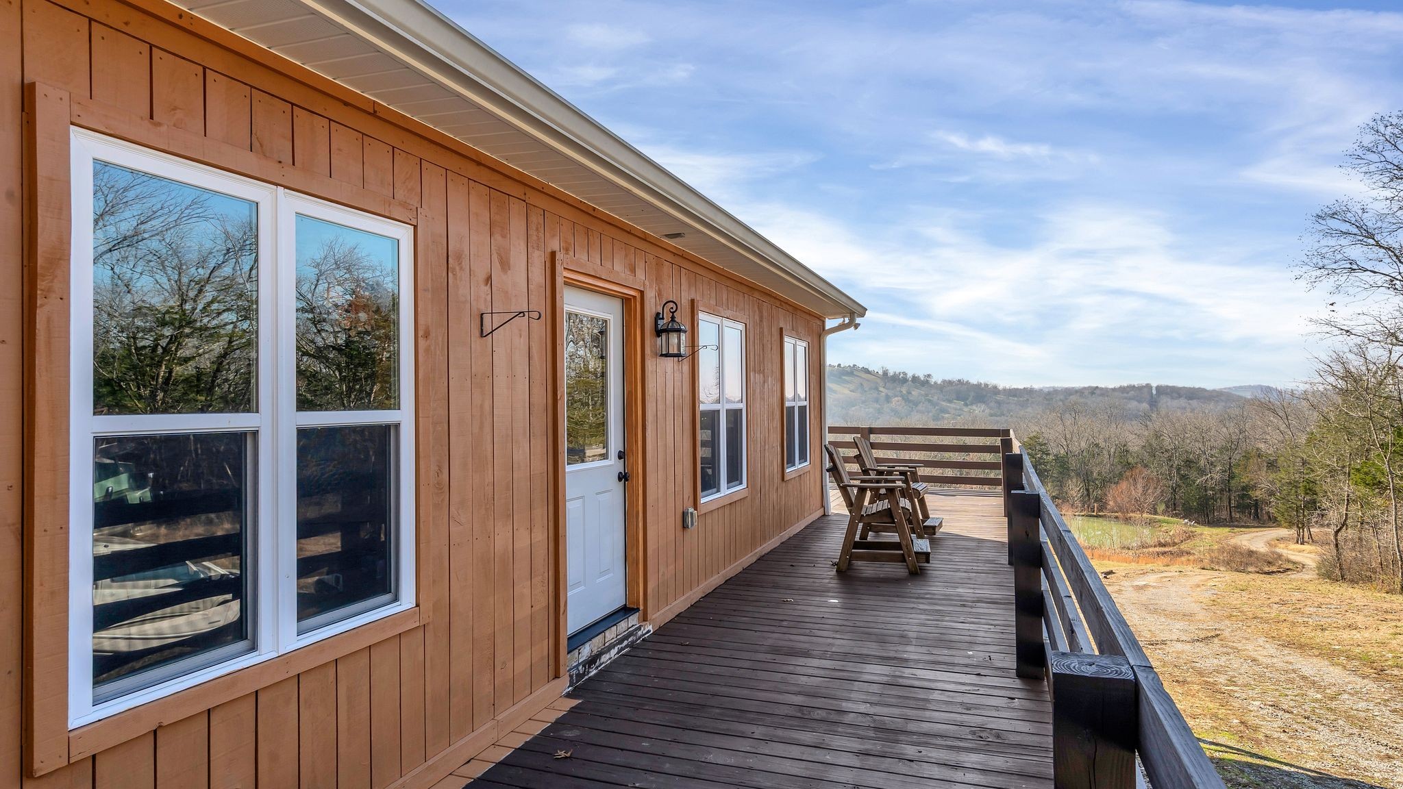 225 Kelso-Smithland Road Kelso, TN 37348 - Photo 5 of 51 a balcony with furniture and wooden floor