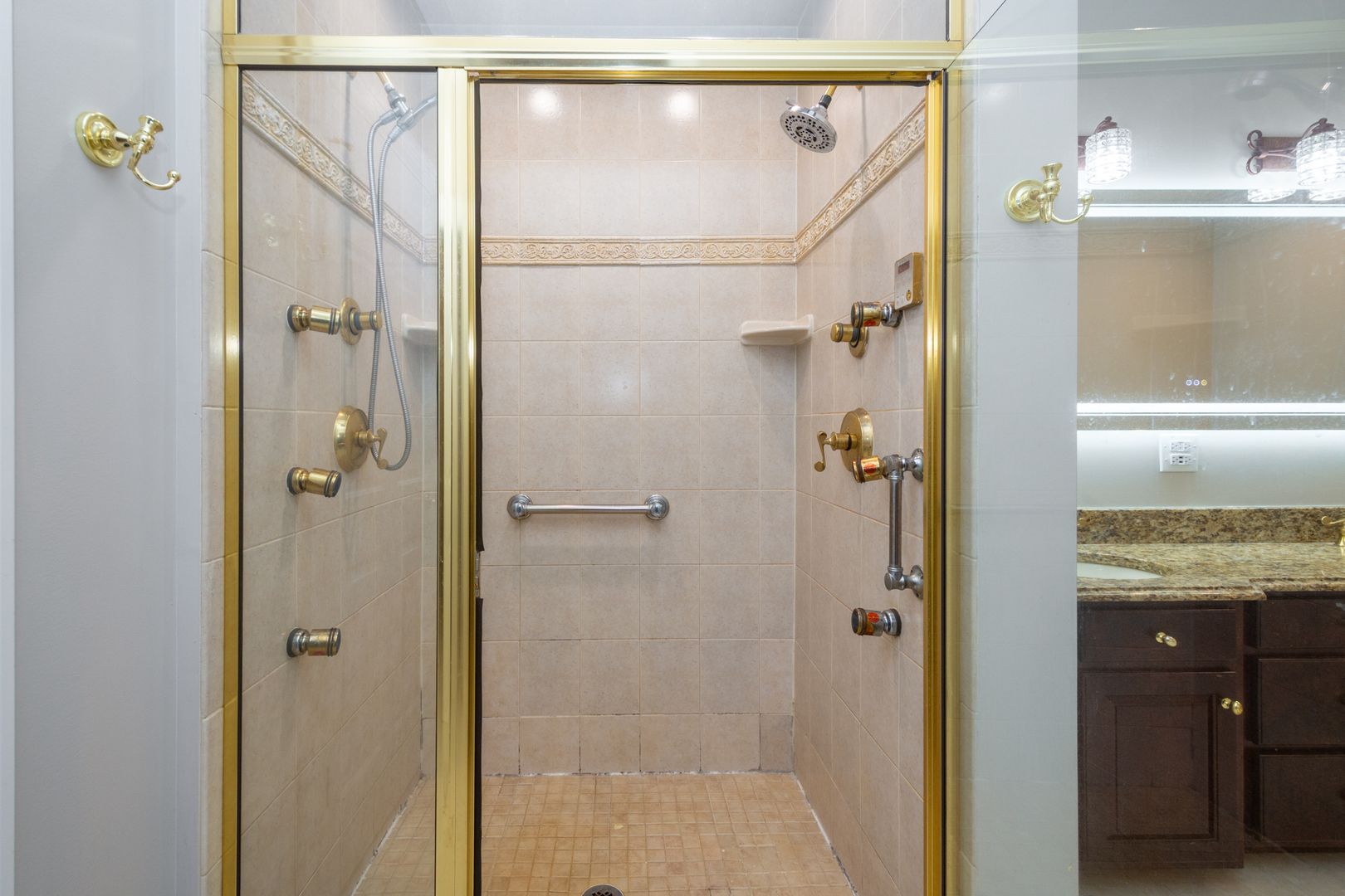 10303 Fox Bluff Lane Spring Grove, IL 60081 - Photo 18 of 44 a bathroom with a shower and a sink