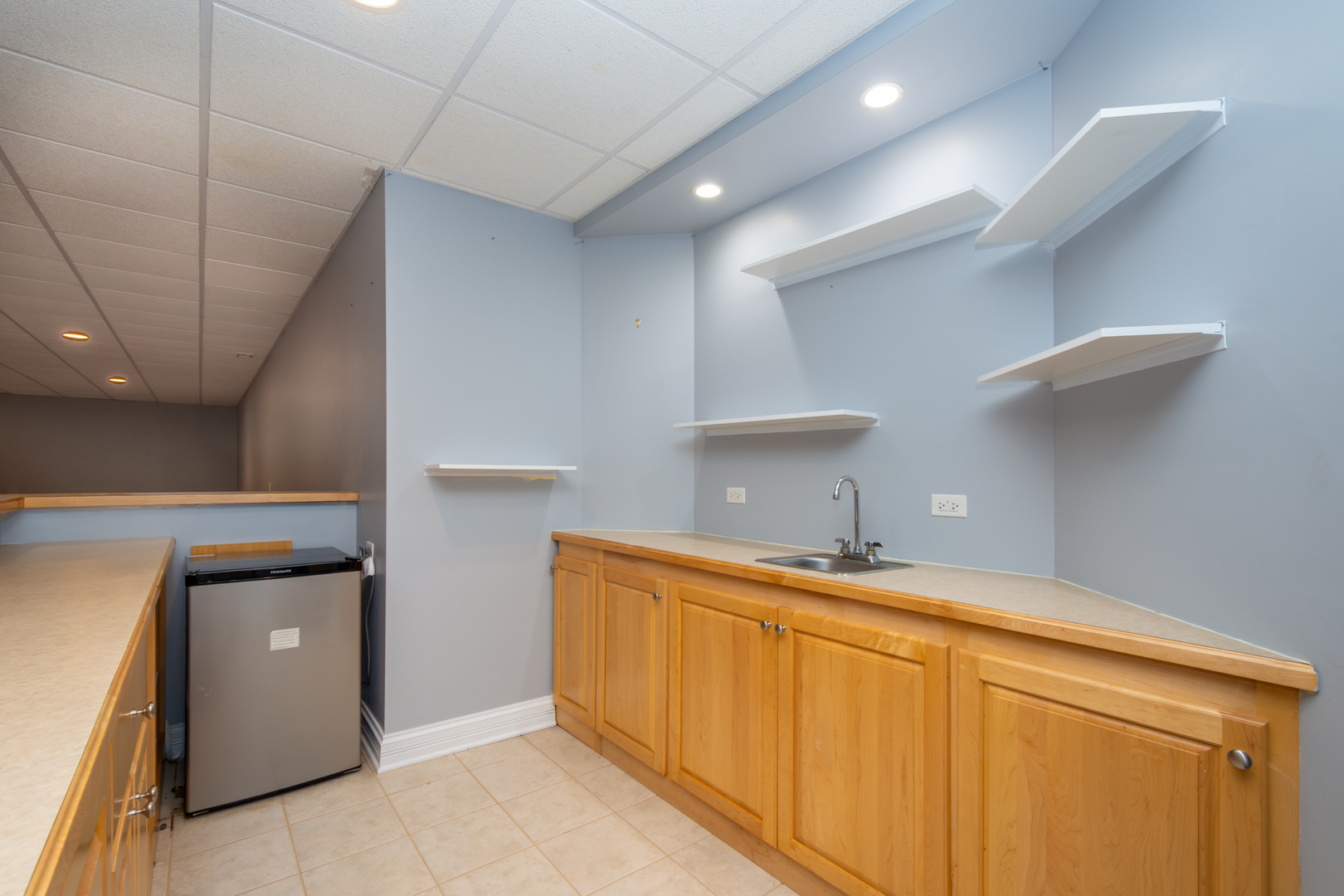 10303 Fox Bluff Lane Spring Grove, IL 60081 - Photo 26 of 44 a kitchen with a sink and cabinets