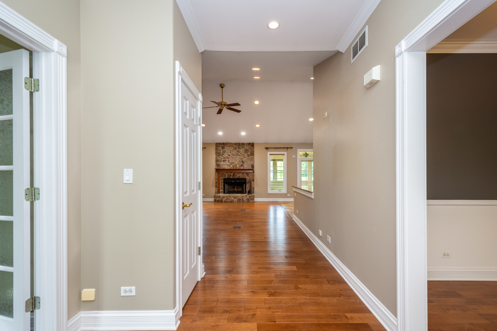 10303 Fox Bluff Lane Spring Grove, IL 60081 - Photo 3 of 44 a view of a hallway with wooden floor