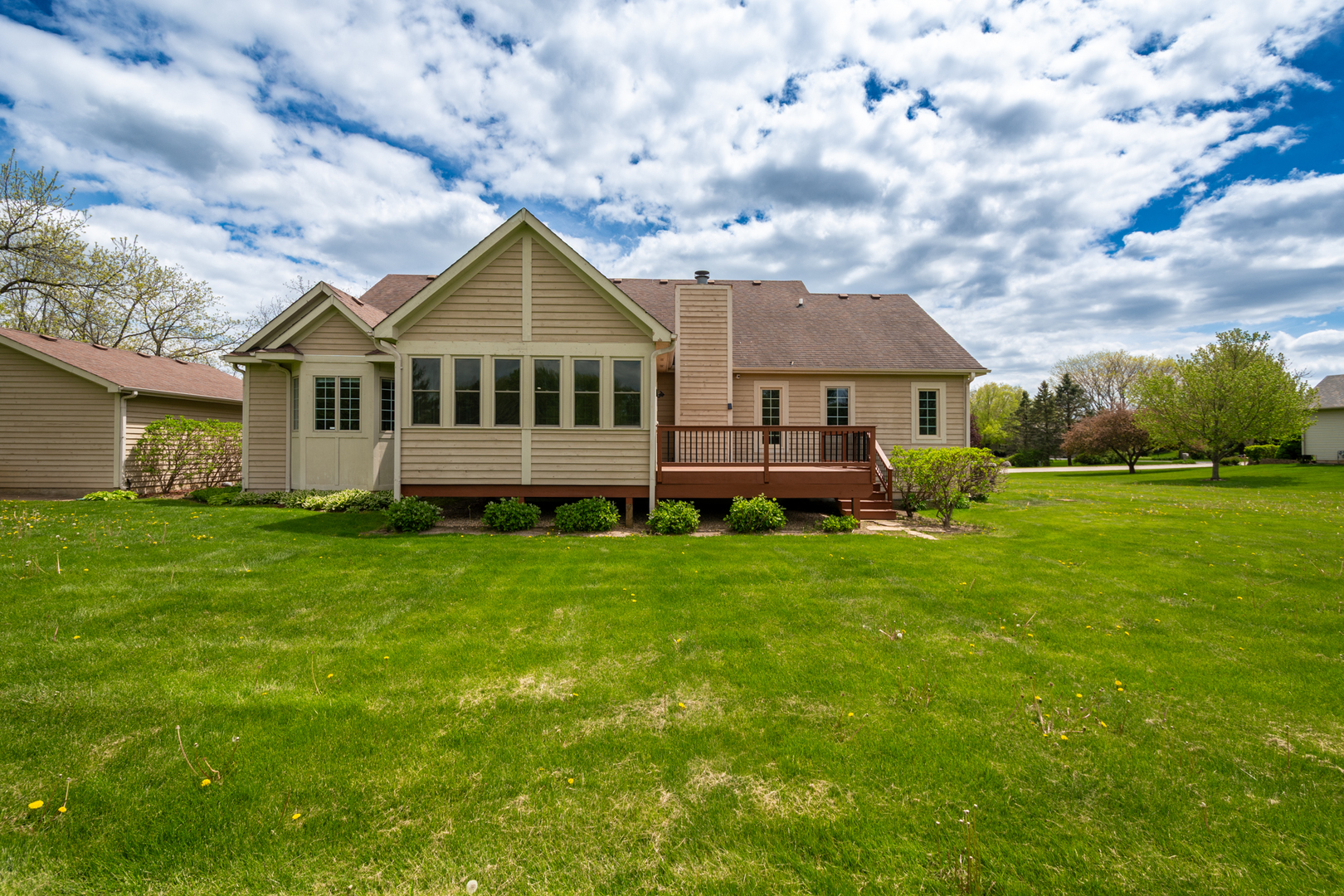 10303 Fox Bluff Lane Spring Grove, IL 60081 - Photo 39 of 44 a front view of a house with a garden