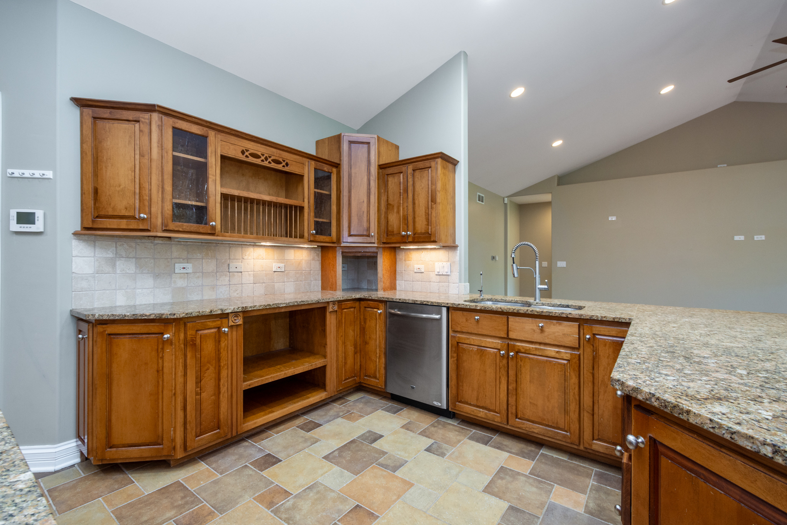 10303 Fox Bluff Lane Spring Grove, IL 60081 - Photo 10 of 44 a kitchen with stainless steel appliances granite countertop a sink and cabinets