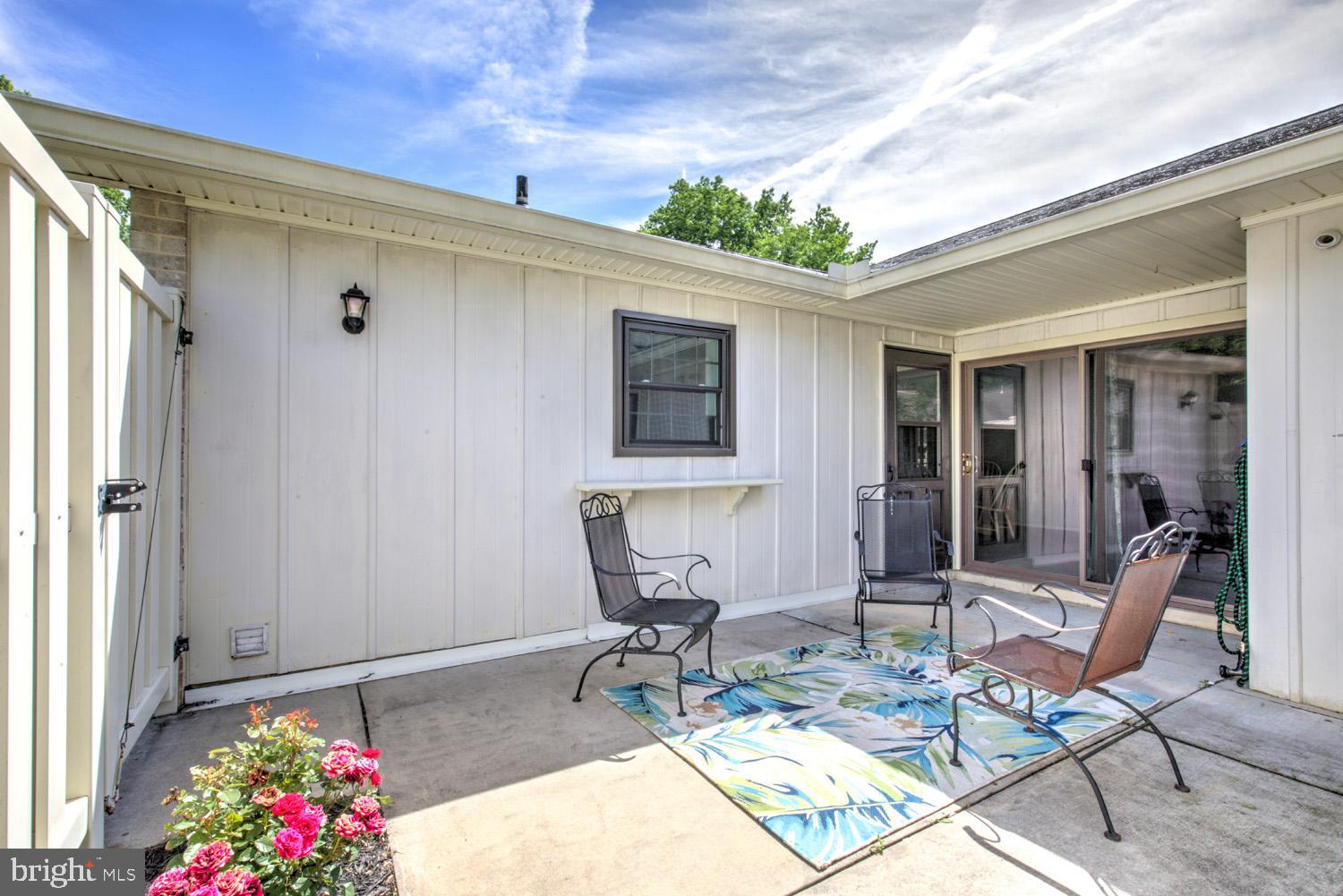425 Valleybrook Drive Lancaster, PA 17601 - Photo 20 of 50 a view of a patio with table and chairs and potted plants