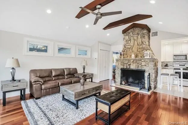 a living room with furniture and a fireplace