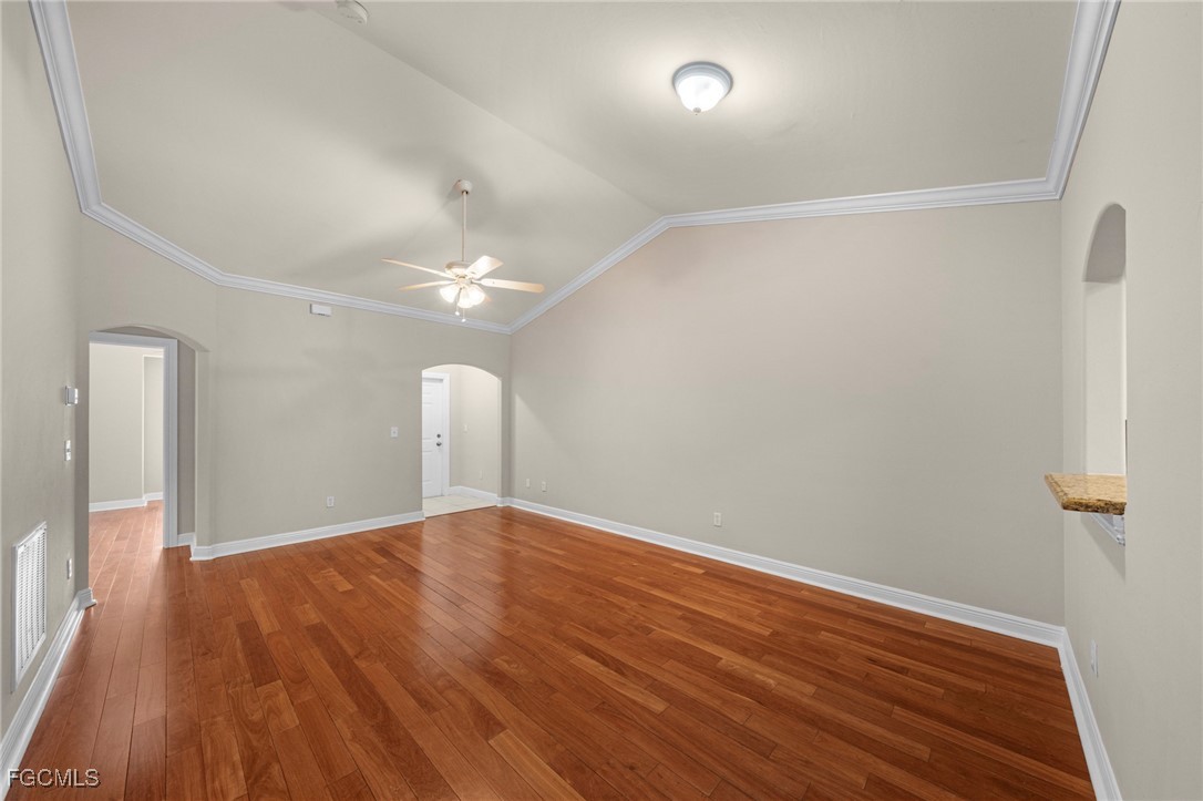4160 Castilla Circle, Unit 106 Fort Myers, FL 33916 - Photo 4 of 37 wooden floor in an empty room with a window