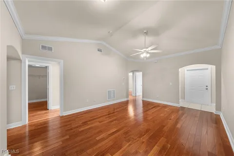 a view of an empty room and wooden floor