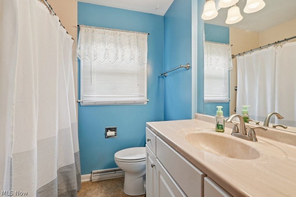 161 Pinehurst Road Munroe Falls, OH 44262 - Photo 18 of 40 Bathroom featuring a light-colored countertop with an integrated sink, a brushed nickel faucet, and a large vanity mirror