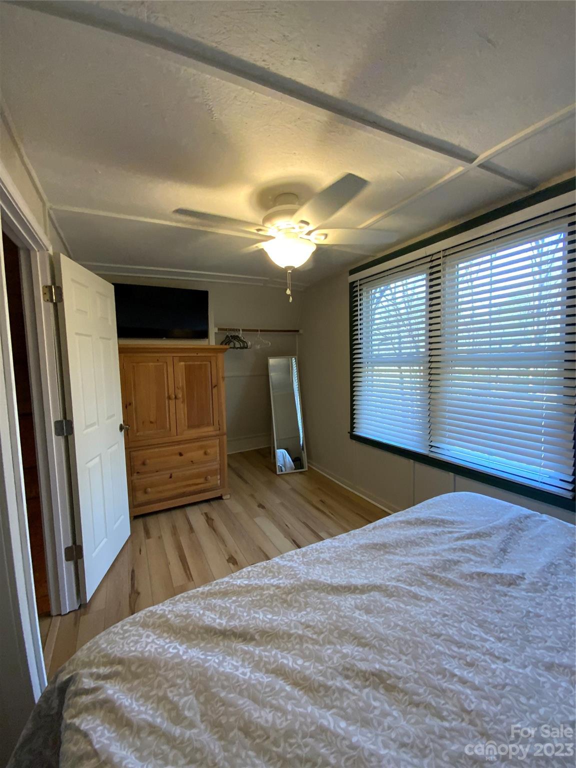 281 Spring Water Drive Brevard, NC 28712 - Photo 10 of 14 a bedroom with a bed and a large window