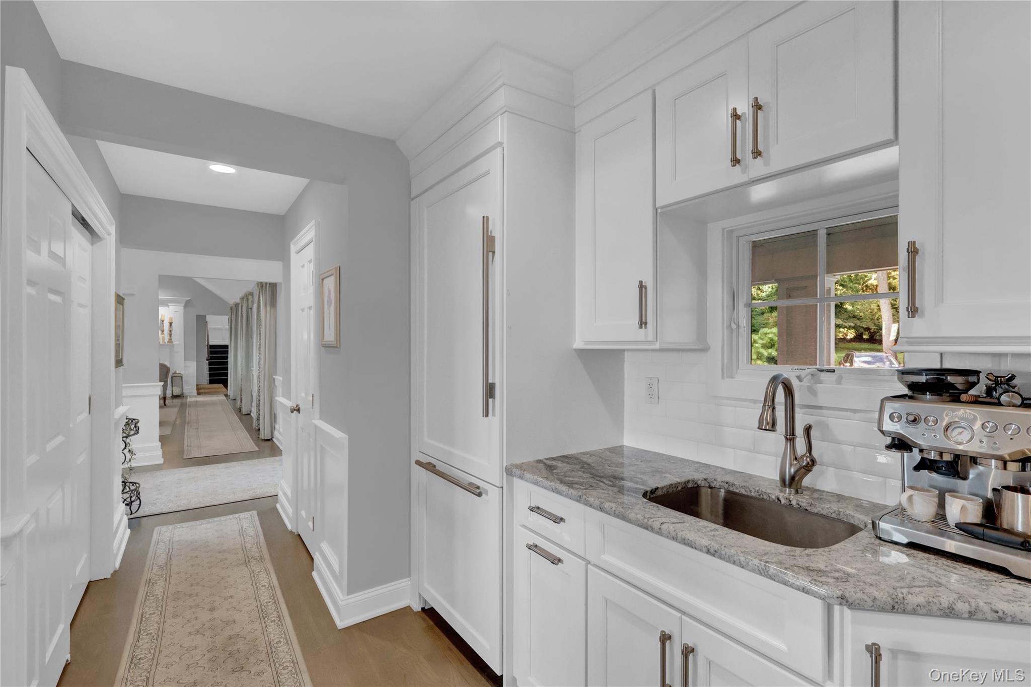 111 Old Field Road Setauket, NY 11733 - Photo 13 of 47 a kitchen with a sink stove and cabinets